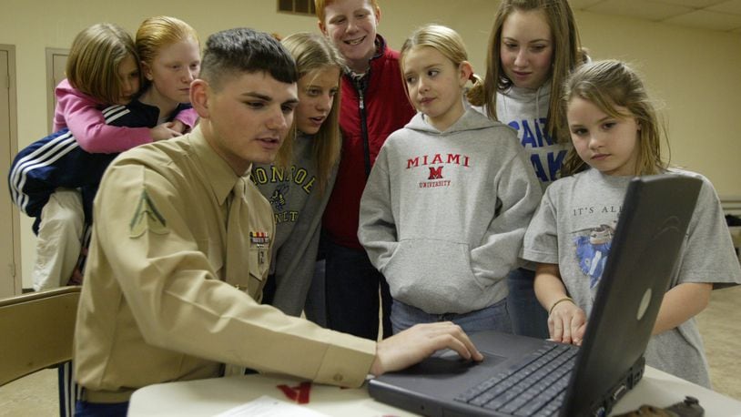 Pictured is Marine Lance Cpl. Adam Enz, when he was 21, visiting a Mid Valley Wranglers 4-H club meeting in March 2006. He shared photos from a recent tour of duty in Iraq. He spoke to the group about his military experience, and to his time as a member of the Mid Valley Riders 4-H club. FILE PHOTO