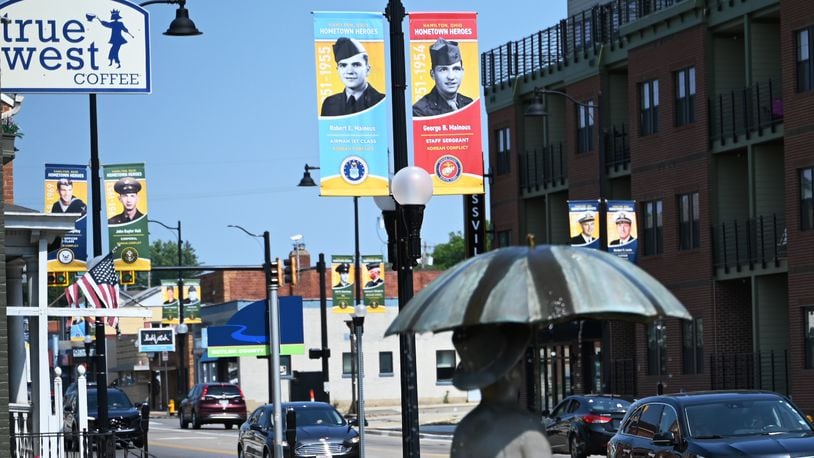 The Hamilton Hometown Heroes banners will annually hang from city posts from Memorial Day through Veterans Day. For 2024, more than 360 banners are displayed throughout Hamilton streets and their locations can be found on the city of Hamilton, the Journal-News, the Greater Hamilton Chamber of Commerce, and the Hamilton Community Foundation websites. Banners represent pictures of current and former Hamilton residents who served or are serving in a branch of the military. MICHAEL D. PITMAN/STAFF