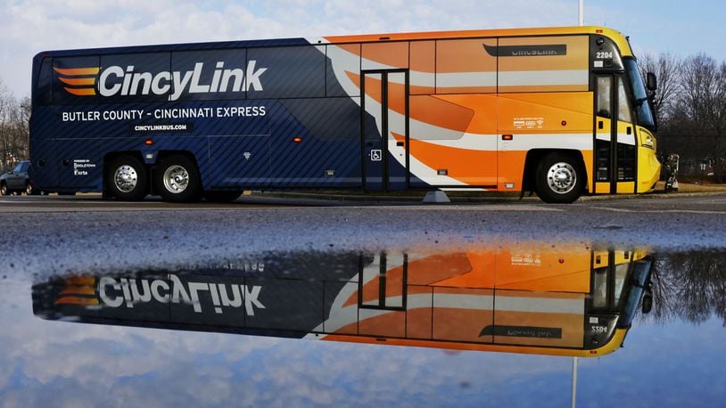The CincyLink bus waits to pick up passengers Friday morning at the Middletown Meijer. NICK GRAHAM/STAFF