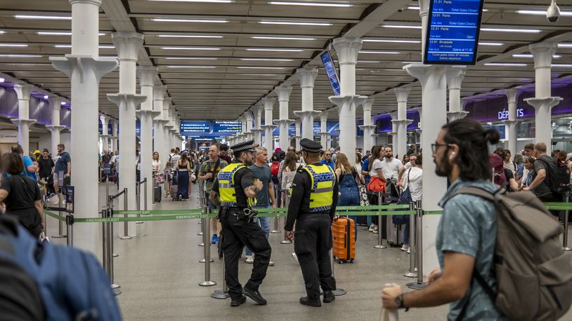 
                        Long lines and security personnel at St Pancras station in London, the British terminus for rail travel under the English Channel to France and the rest of Europe beyond, on Friday, July 26, 2024. Coordinated arson attacks disrupted service on three high-speed train lines in France on Friday, causing travel chaos on the day of the opening ceremony of the Olympics in Paris. (Andrew Testa/The New York Times)
                      