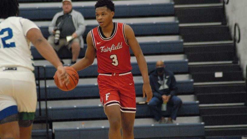 Fairfield sophomore Kameron Sanders brings the ball up court against Winton Woods during a Division I sectional contest on Monday night at West Clermont. Sanders scored 15 points. Chris Vogt/CONTRIBUTED