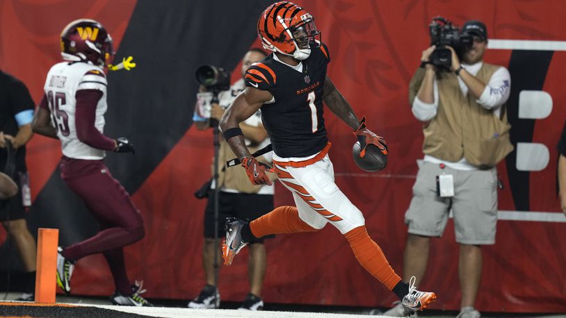 Cincinnati Bengals wide receiver Ja'Marr Chase (1) celebrates after catching a 41-yard touchdown pass during the first half of an NFL football game against the Washington Commanders, Monday, Sept. 23, 2024, in Cincinnati. (AP Photo/Carolyn Kaster)