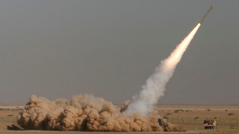 FILE - In this photo released by the Iranian semi-official Fars News Agency, Revolutionary Guard's Fateh missile is launched in a drill near the city of Qom, 80 miles (130 kilometers) south of the capital Tehran, Iran, Sept. 27, 2009. (Ali Shaigan/Fars News Agency via AP File)