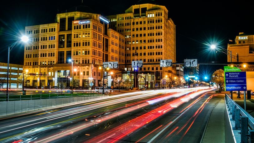 Light trails from passing motorists light up High Street with the Butler County Government Services Center in the background during this 30-second exposure , April 15 in Hamilton. NICK GRAHAM/STAFF