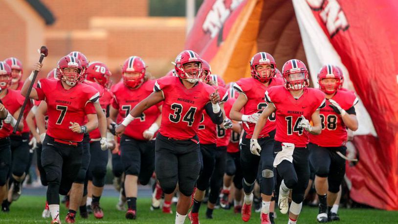 The Madison Mohawks take the field before their 54-0 victory over visiting Carlisle on Oct. 5 at Brandenburg Field in Madison Township. NICK GRAHAM/STAFF