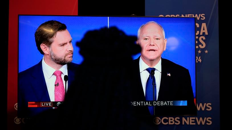 Viewers in the spin room watch the CBS News vice presidential debate, Tuesday, Oct. 1, 2024, in New York. (AP Photo/Julia Demaree Nikhinson)