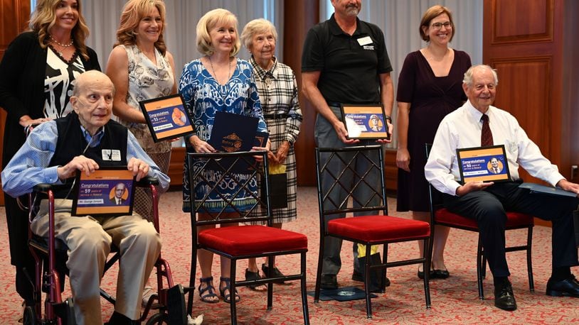 Four Hamilton Rotarians were honored at the Sept. 5, 2024, meeting for service of at least 50 years. George Jonson, 90, seat at left, had been with the Hamilton Rotary for 59 years. Bob Weigel, 77, seat at right, has been a part of the club for 50 years. Also honored was Richard Underwood, 95, was honored for his 53 years of service. He was not able to attend the meeting. Ricardo Bethart, who passed away in August at 92 years old, had served with the club for 50 years. Underwood and Bethart's families accepted the recognition on their behalves. MICHAEL D. PITMAN/STAFF