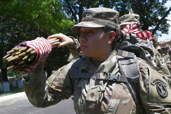 Soldiers place flags at Arlington National Cemetery for Memorial Day