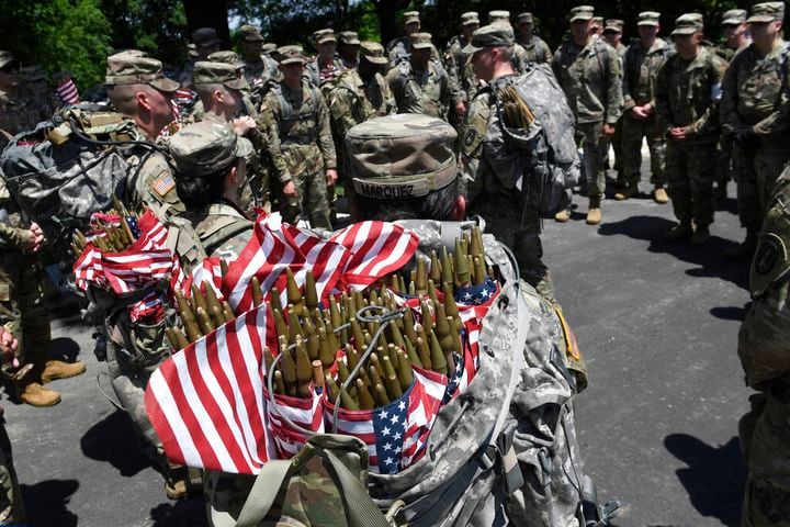 Soldiers place flags at Arlington National Cemetery for Memorial Day