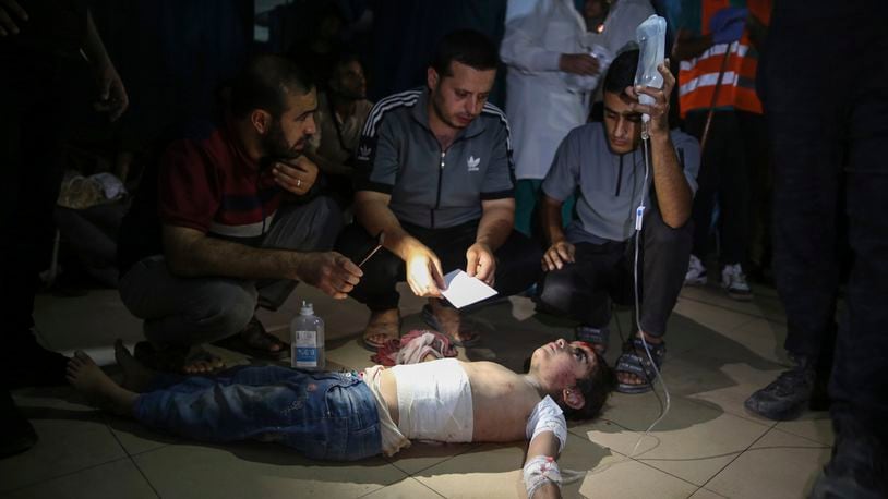 An injured Palestinian girl is treated at Al-Aqsa Martyrs Hospital in Deir al Balah, Gaza Strip, Friday, June 14, 2024. An Israeli airstrike on a home in the central city in the Gaza Strip killed two people and wounded several others including children, hospital officials said. (AP Photo/Mohammad Hajjar)