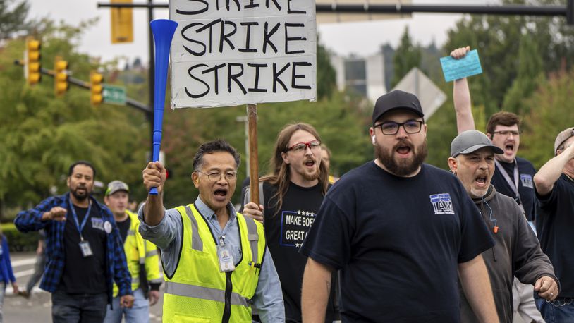 International Aerospace Machinists union members march toward the union's hall to vote on a contract offer with airplane maker Boeing, on Thursday, Sept. 12, 2024, in Renton, Wash. (AP Photo/Stephen Brashear)