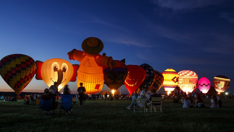 The Ohio Challenge Hot Air Balloon and Skydiving Festival kicked off the weekend event Friday, July 19, 2024 at Smith Park in Middletown with balloon launch and glow, flag and pyrotechnics jumps by Team Fastrax, fireworks show by Yokum Fireworks, a drone show and more. NICK GRAHAM/STAFF