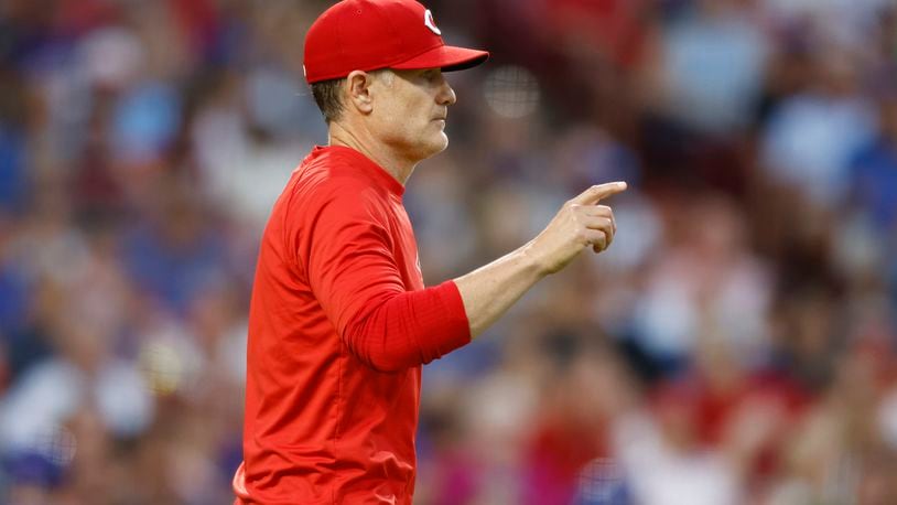 Cincinnati Reds manager David Bell walks to the mound during the seventh inning of the team's baseball game against the Chicago Cubs in Cincinnati, Thursday, June 6, 2024.. (AP Photo/Paul Vernon)