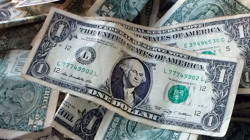 FILE - Dollar bills are shown in New York, Oct. 24, 2016. (AP Photo/Mark Lennihan, File)