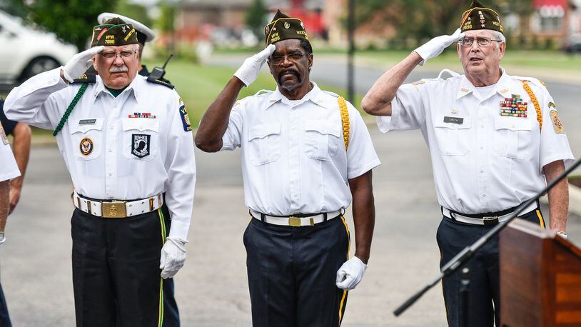 Several 9/11 events are planned throughout Butler and Warren counties Saturday in recognition of the 20th anniversary. Here, Ron Dzikowski, left, Donald Carter and Dave Smith, members of the West Chester VFW 7696 Color Guard, salute the flag during a 9/11 remembrance ceremony on Sept. 11, 2018 at Chesterwood Village Senior Living Community on Tylersville Road in West Chester Twp. NICK GRAHAM/STAFF