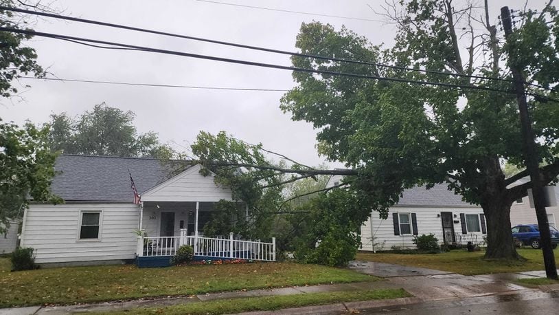 Several large branches of a tree fell onto a house in Trenton as heavy rain and high wind from the remnants of Hurricane Helene moved through the area Friday, Sept. 27, 2024. NICK GRAHAM/STAFF