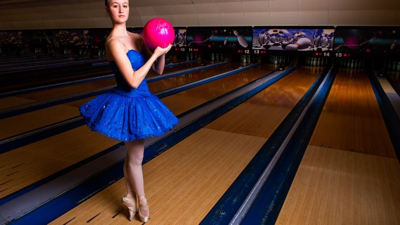 Clare Sherman, 15, with Miami Valley Ballet Theatre, poses for a photo at Pohlman Lanes and Family Entertainment Complex on Pyramid Hill Blvd. in Hamilton.
  Hamilton’s very own Miami Valley Ballet Theatre dancers are trading out their ballet slippers for bowling shoes, for a very special performance at Pohlman Lanes. Their brand new show is a Fab Four inspired production featuring the music of the Beatles that features an exciting mix of contemporary and modern dance. The Ballet, Beatles and Bowling show is part of Fitton Center's "Outside The Box" series showcasing live arts at around Hamilton. The performance is Sunday, April 11 from 3-5 p.m. NICK GRAHAM / STAFF 