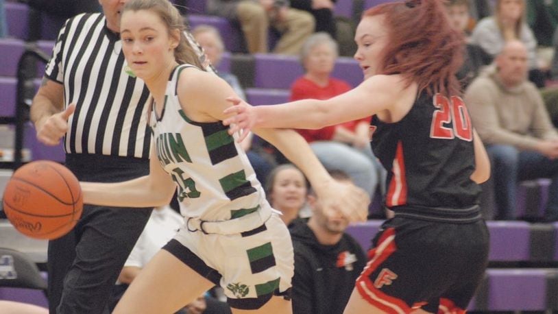 Badin sophomore Gracie Cosgrove (left) is guarded by Franklin senior Addie Lloyd during their Division II sectional contest on Wednesday night at Middletown. The Rams won 71-6. Chris Vogt/CONTRIBUTED