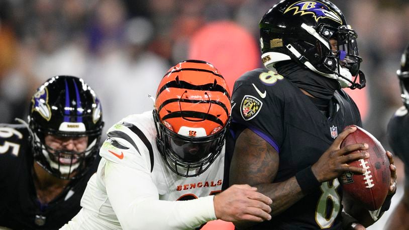 Cincinnati Bengals defensive end Trey Hendrickson (91) sacks Baltimore Ravens quarterback Lamar Jackson (8) in the first half of an NFL football game in Baltimore, Thursday, Nov. 16, 2023. (AP Photo/Nick Wass)