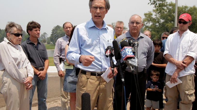 FILE - Charles McMillan, center, director of Los Alamos Laboratory, talks to reporters during a news conference in Los Alamos, N.M., June 28, 2011. (AP Photo/Jae C. Hong, File)