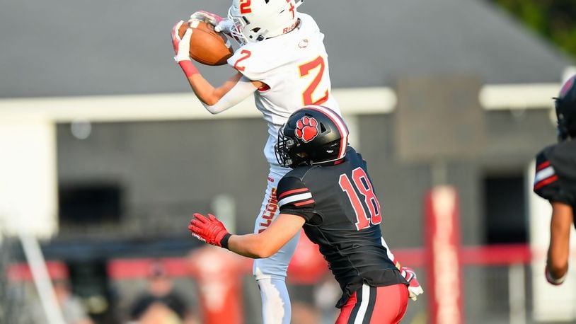 Fenwick's Jackson Kauffman (2) makes the catch in front of Franklin's Tucker Campbell (18) during their season opener on Friday night at Franklin's Atrium Stadium. Kyle Hendrix/CONTRIBUTED