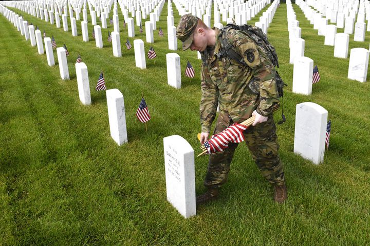 Soldiers place flags at Arlington National Cemetery for Memorial Day