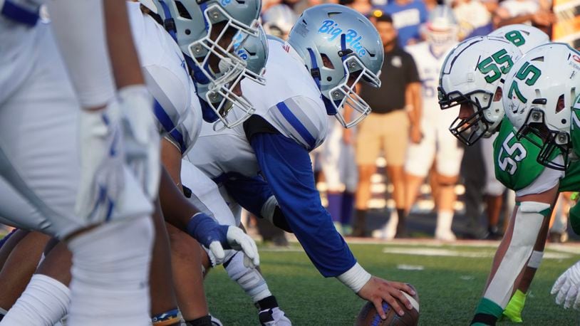 Hamilton (left) lines up against Badin during last week's game. Big Blue opens Greater Miami Conference play Friday at Lakota West. Chris Vogt/CONTRIBUTED