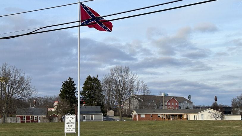 Someone put up a large Confederate flag and a "Welcome to Harrison" sign together on private property along a busy road in the southwest Ohio town as 2023 turned to 2024. WCPO photo