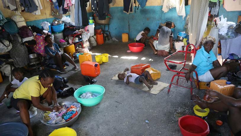 Families displaced by gang violence do laundry inside a school where they have been taking refuge for over a year in Port-au-Prince, Haiti, Friday, Sept. 20, 2024. (AP Photo/Odelyn Joseph)