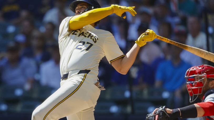 Milwaukee Brewers Willy Adames (27) watches his three-run home run during the first inning of a baseball game against the St. Louis Cardinals Monday, Sept. 2, 2024, in Milwaukee. (AP Photo/Jeffrey Phelps)