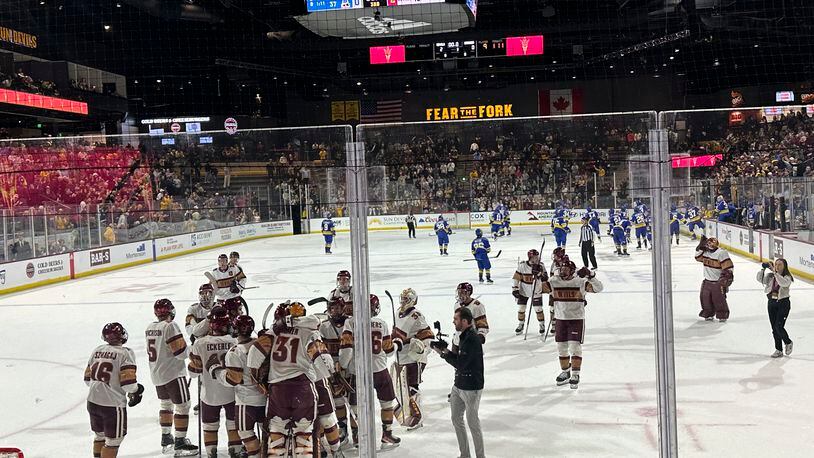 FILE - Arizona State players celebrate after beating Alaska Anchorage in an NCAA college hockey game on Friday, Feb. 9, 2024, at Mullett Arena in Tempe, Arizona. (AP Photo/Stephen Whyno)