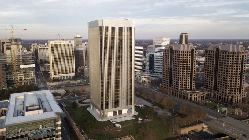 FILE - The Federal Reserve building, center, rises high over the skyline of Richmond, Va., on Dec. 4, 2017. (AP Photo/Steve Helber, File)