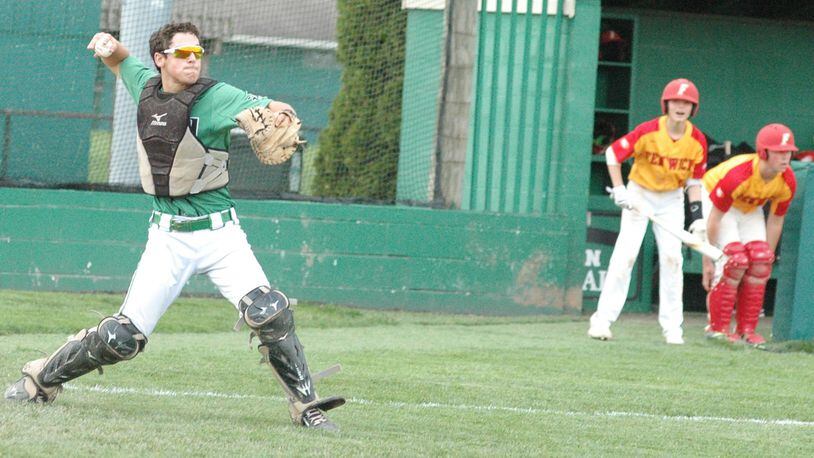 Badin catcher Dylan Ballauer winds up to make a throw during Wednesday’s Greater Catholic League Coed Division baseball game against visiting Fenwick at Alumni Field in Joyce Park. Badin won 12-2 in five innings. RICK CASSANO/STAFF