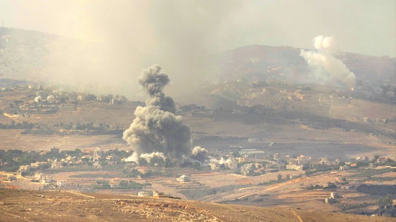 Smoke rises from Israeli airstrikes on villages in the Nabatiyeh district, seen from the southern town of Marjayoun, Lebanon, Monday, Sept. 23, 2024. (AP Photo/Hussein Malla)