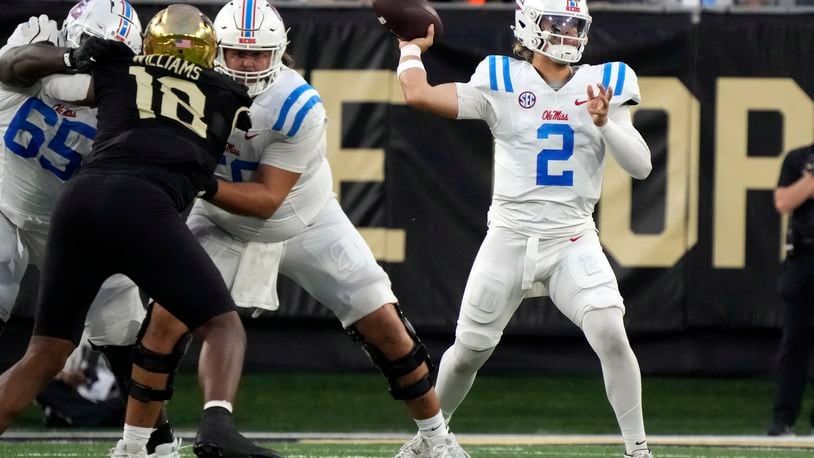 Mississippi quarterback Jaxson Dart (2) looks to pass against Wake Forest during the first half of an NCAA college football game in Winston-Salem, N.C., Saturday, Sept. 14, 2024. (AP Photo/Chuck Burton)