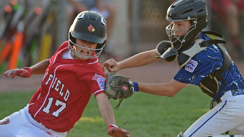 Hamilton West Side catcher Curtus Moak tags out Canfield’s Jake Grdic at the plate during Tuesday’s winners’ bracket final of the Ohio Little League tournament at Boardman’s Fields of Dreams. West Side won 2-0. DAVID DERMER/THE VINDICATOR