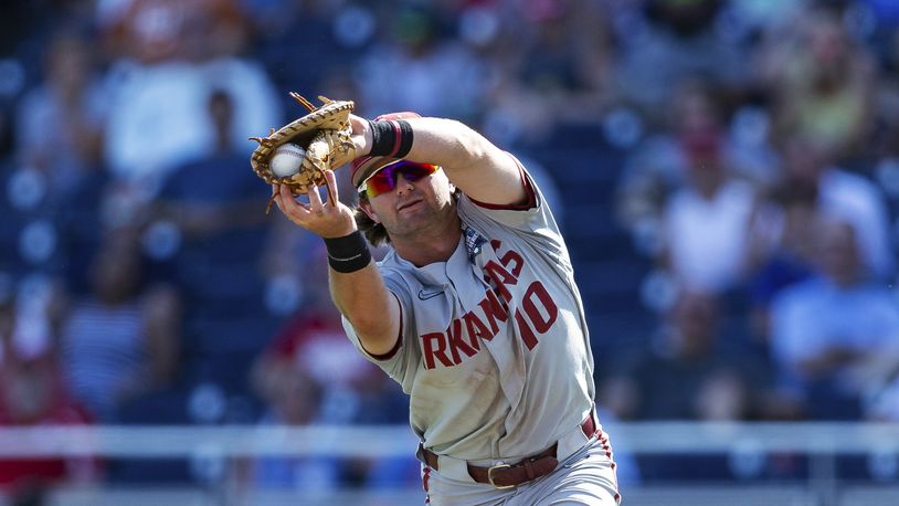 Arkansas first baseman Peyton Stovall makes a catch for an out against Mississippi during the ninth of an NCAA College World Series baseball game Thursday, June 23, 2022, in Omaha, Neb. (AP Photo/John Peterson)