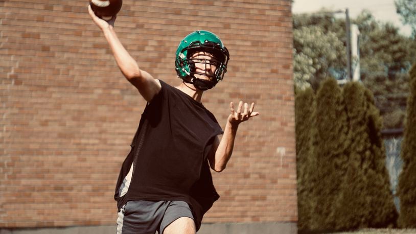 New Miami quarterback Sam Mayer throws a pass during practice last week at New Miami High School. Chris Vogt/CONTRIBUTED