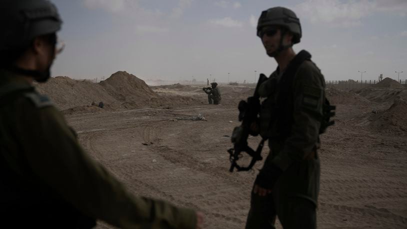 Israeli soldiers take up positions next to the Philadelphi Corridor along the border with Egypt, in the Gaza Strip on Friday, Sept. 13, 2024. (AP Photo/Leo Correa)