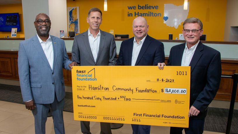 The First Financial Foundation provided a grant in the amount of $160,000 to the Hamilton Community Foundation to commemorate First Financial Bank's 160-year anniversary, which they celebrated in August 2023. These funds will be awarded over the next four years to local nonprofit organizations in Hamilton. Pictured are Roddell McCullough of First Financial Bank, Greg Harris of Yellow Cardinal Advisory Group, Chris Motley of First Financial Bank, and John Guidugli, president and CEO of Hamilton Community Foundation. PROVIDED