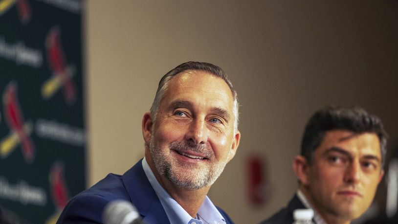 St. Louis Cardinals President of baseball operations John Mozeliak, left, fields questions from reporters as Chaim Bloom looks on during a press conference Monday, Sept. 30, 2024, at Busch Stadium in St. Louis. (Zachary Linhares/St. Louis Post-Dispatch via AP)