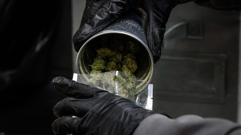 Recreational marijuana is processed and packaged in a back room at Amazing Budz in Adrian, Michigan. JIM NOELKER/STAFF