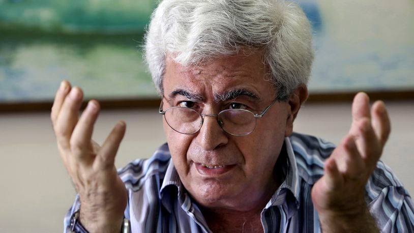 FILE - Lebanese prominent writer and intellectual Elias Khoury speaks during an interview with The Associated Press at his office in the Institute for Palestine Studies in Beirut, Lebanon, Friday, Aug. 8, 2014. (AP Photo/Bilal Hussein, File)