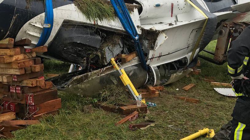 Crews remove wreckage of a Thunderbird jet that flipped over after taxiing at Dayton International Airport on Friday, June 23, 2017. A Thunderbirds statement said the F-16D Fighting Falcon was conducting a “single-ship familiarization” when it had the “mishap.” CONTRIBUTED