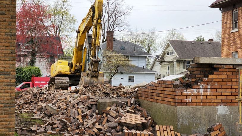 Vickers Demolition knocked down a house on Central Avenue in Middletown that was in danger of collapsing and damaging the house next door, according to city officials. NICK GRAHAM/STAFF