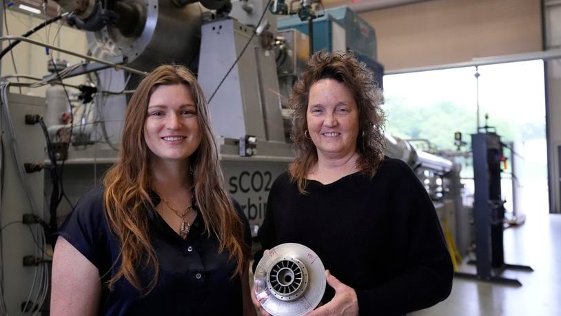 Cindy Taff, right, and Brianna Byrd, left, with Sage Geosystems, a startup that aims to make clean electricity, pose while visiting Southwest Research Institute where testing and research is taking place in San Antonio, Monday, April 1, 2024. (AP Photo/Eric Gay)