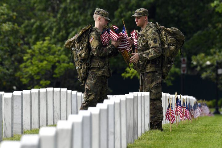 Soldiers place flags at Arlington National Cemetery for Memorial Day