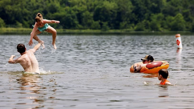 The Hamilton family cools off in Acton Lake at Hueston Woods State Park Monday, June 17, 2024. NICK GRAHAM/STAFF