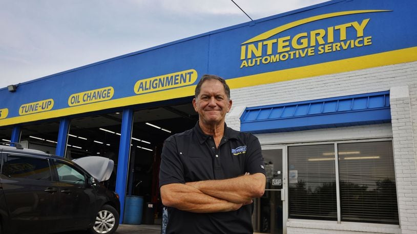 Pete Esposito, owner of Integrity Automotive Service, stands in front of the shop in Middletown. Integrity Automotive is celebrating 25 years in business. NICK GRAHAM/STAFF