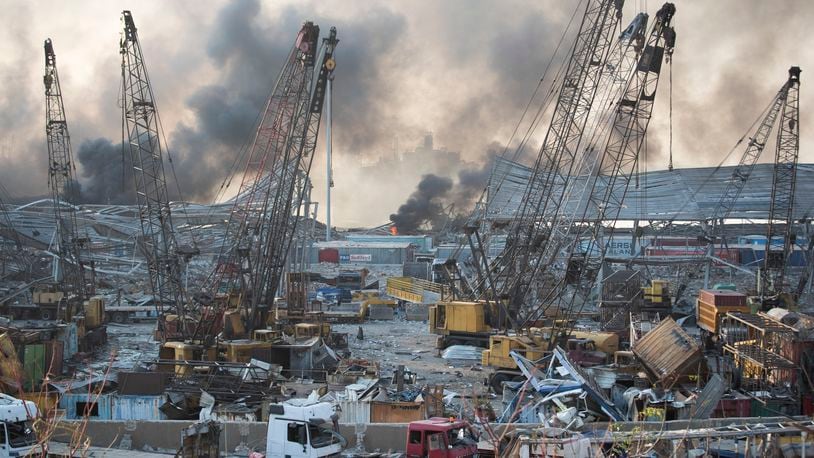 FILE - Smoke rises after a massive explosion at the port in Beirut, on Aug. 4, 2020. (AP Photo/Hassan Ammar, File)